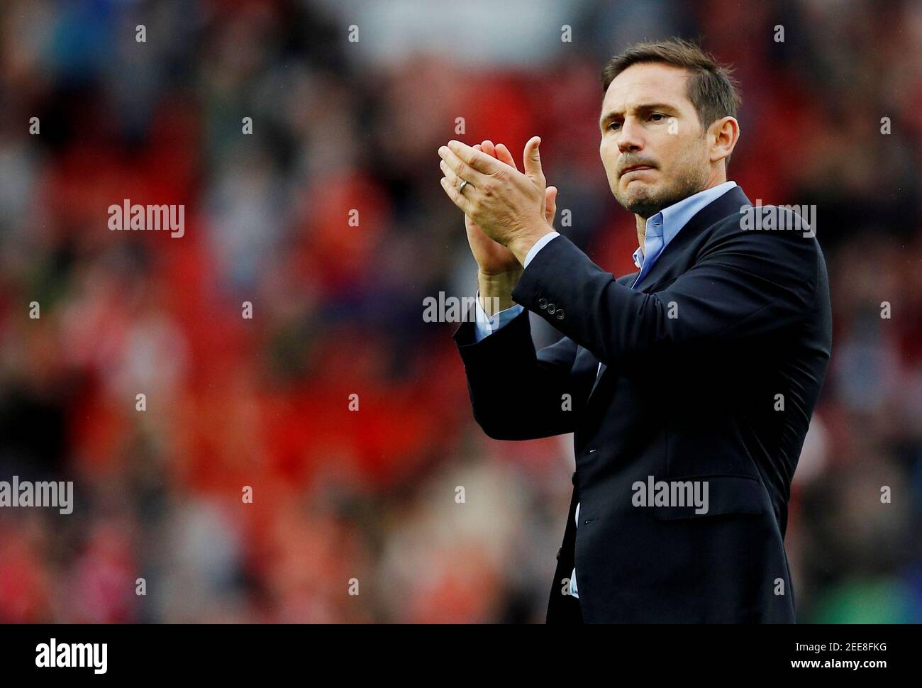 Soccer Football - Premier League - Manchester United v Chelsea - Old Trafford, Manchester, Britain - August 11, 2019  Chelsea manager Frank Lampard applauds fans at the end of the match     REUTERS/Phil Noble  EDITORIAL USE ONLY. No use with unauthorized audio, video, data, fixture lists, club/league logos or 'live' services. Online in-match use limited to 75 images, no video emulation. No use in betting, games or single club/league/player publications.  Please contact your account representative for further details. Stock Photo