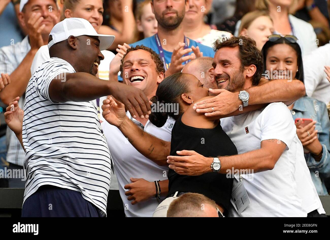 Tennis - Wimbledon - All England Lawn Tennis and Croquet Club, London,  Britain - July 5, 2019 Parents of Cori Gauff, Corey and Candi Gauff  celebrate with Jean-Christophe Faurel after Cori Gauff