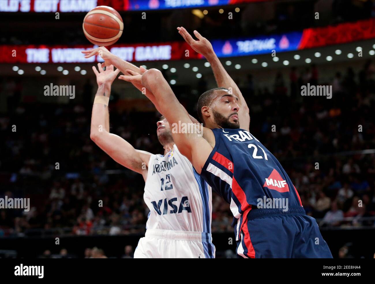 Basketball - FIBA World Cup - Semi Finals - Argentina v France - Wukesong Sport Arena, Beijing, China - September 13, 2019 Argentina's Marcos Delia in action with France's Rudy Gobert REUTERS/Jason Lee Stock Photo