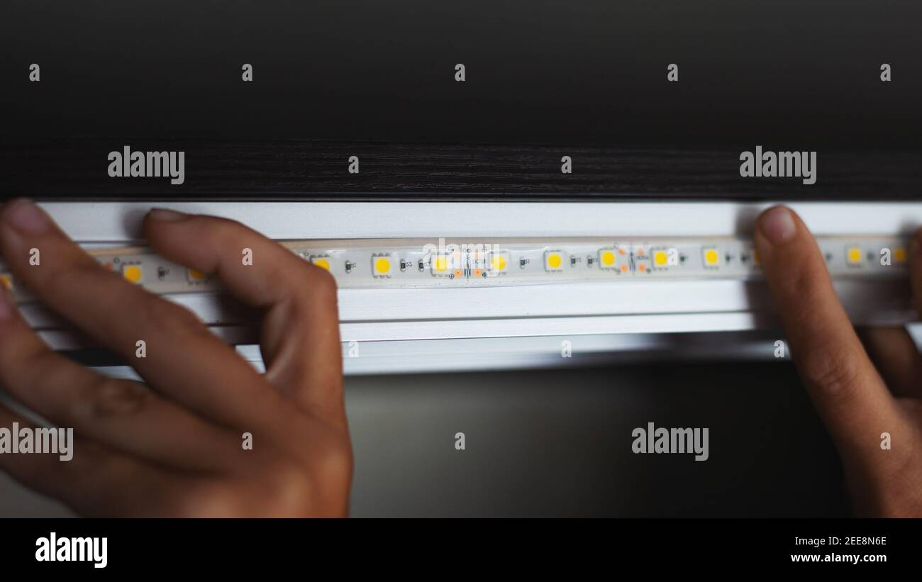 process installation of decorative led strip lighting Stock Photo Alamy