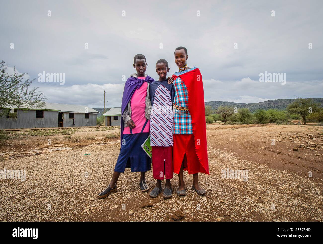 Nairobi, Kenya. 14th Feb, 2021. Young Maasai girls dressed in their colorful gowns are seen heading to Church on a Sunday Morning In Olekimunke in Kajiado. Credit: SOPA Images Limited/Alamy Live News Stock Photo