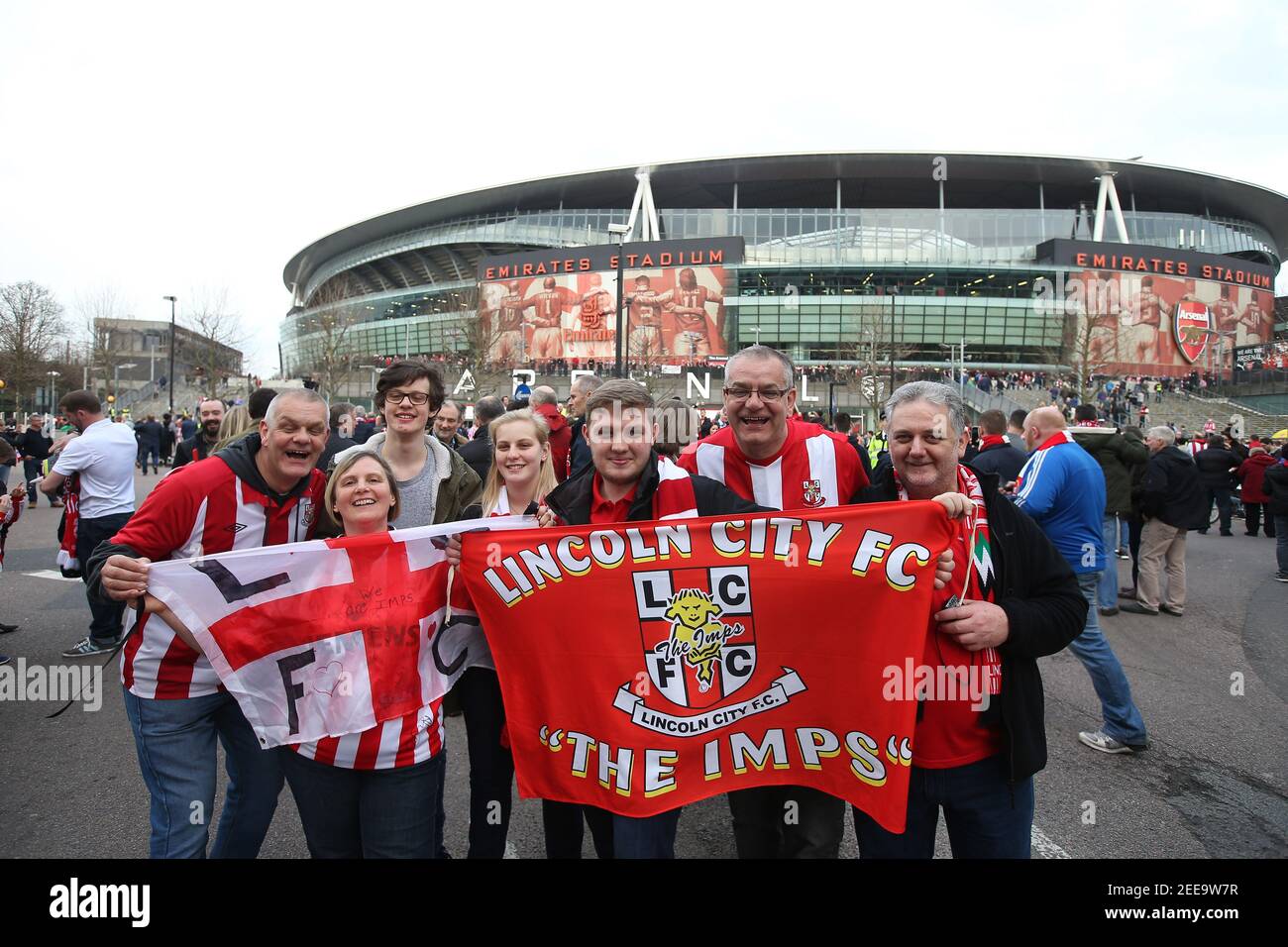 Britain Football Soccer - Arsenal v Lincoln City - FA Cup Quarter Final - The Emirates Stadium - 11/3/17 Lincoln fans pose outside the stadium before the match  Reuters / Paul Hackett Livepic EDITORIAL USE ONLY. No use with unauthorized audio, video, data, fixture lists, club/league logos or 'live' services. Online in-match use limited to 45 images, no video emulation. No use in betting, games or single club/league/player publications.  Please contact your account representative for further details. Stock Photo