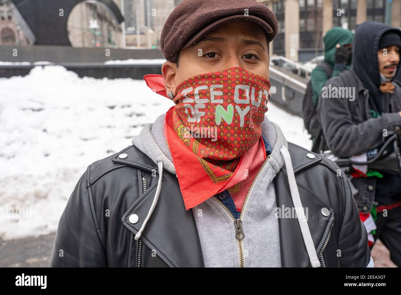 NEW YORK, NY - FEBRUARY 15: A protester ware an ICE out of NYC bandana at Foley Square during an Abolish ICE (Immigration and Customs Enforcement) protest on February 15, 2021 in New York City.   Free Them All by Abolish ICE Coalition marched for Javier Castillo Maradiaga through downtown New York City. Mr. Maradiaga, a 27-year-old Bronx man who has lived in the U.S. since he was 7 years old was set to be deported by the U.S. Immigration and Customs Enforcement (ICE). Stock Photo