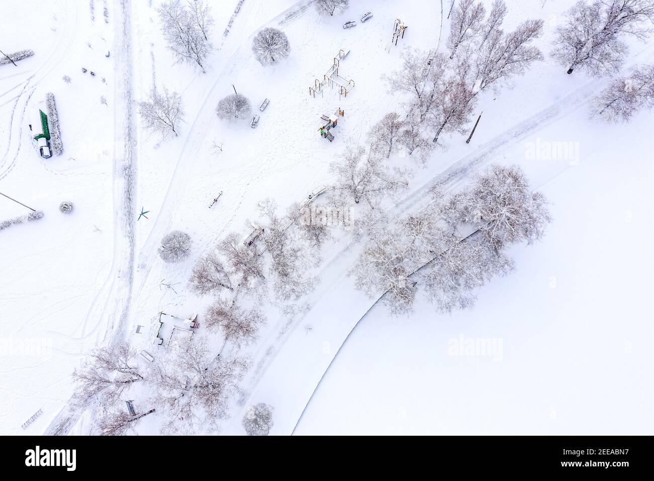 winter park landscape. empty playground covered with snow. top view aerial photo from flying drone Stock Photo