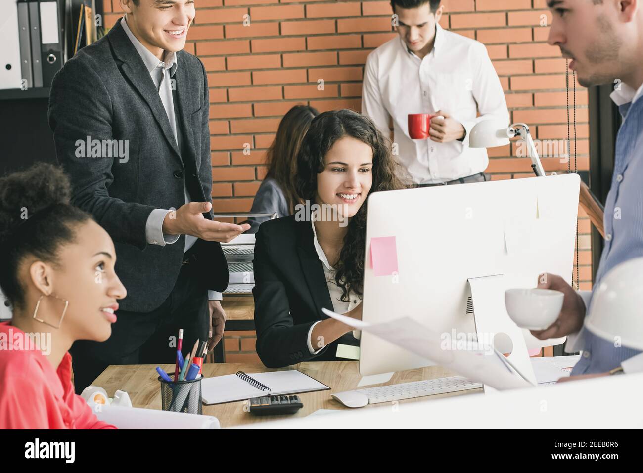 Young multiethnic group of business people working in shared office space Stock Photo