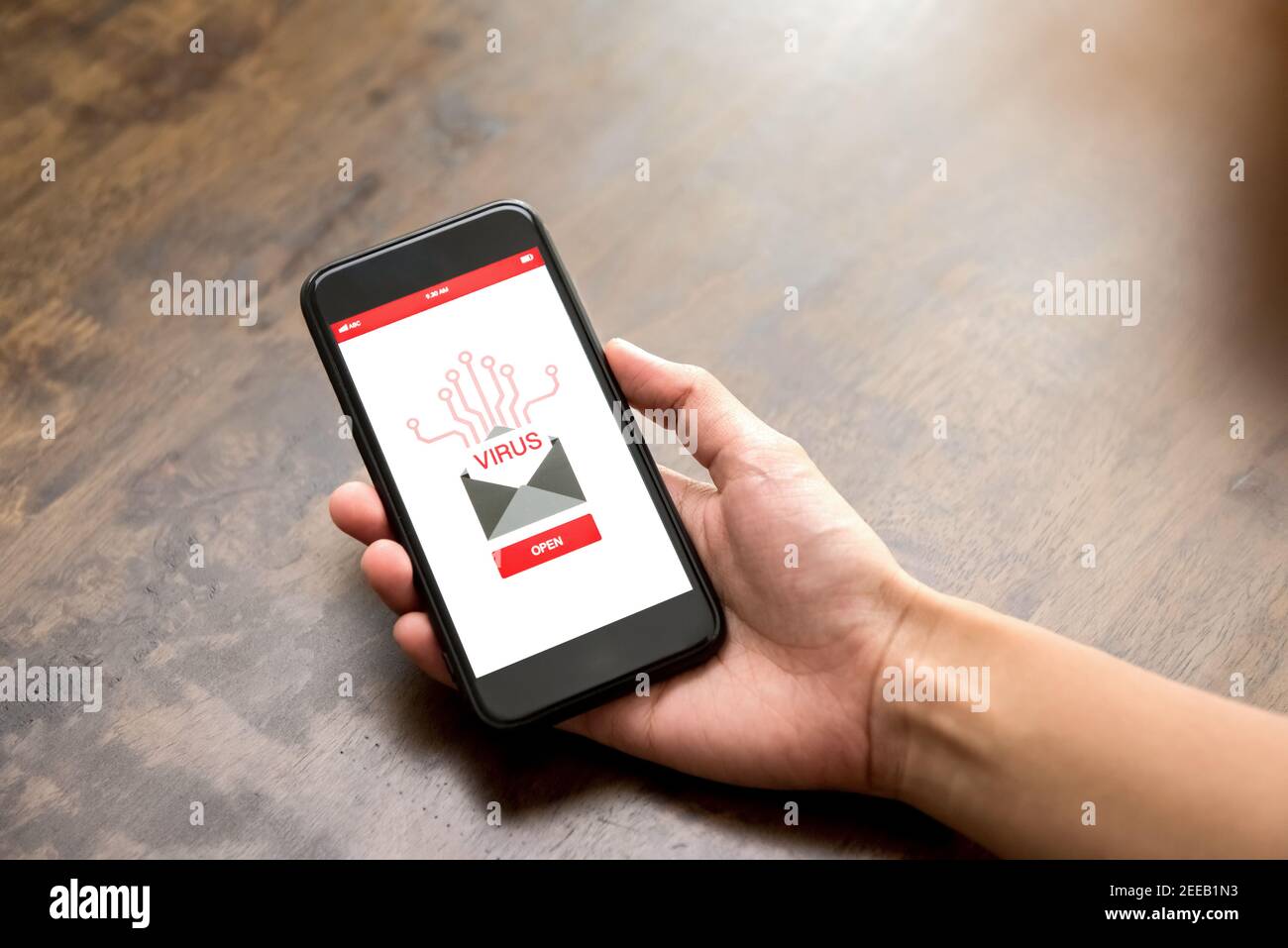 Spam or virus notification email alerted on mobile phone screen - cyberattack concept Stock Photo