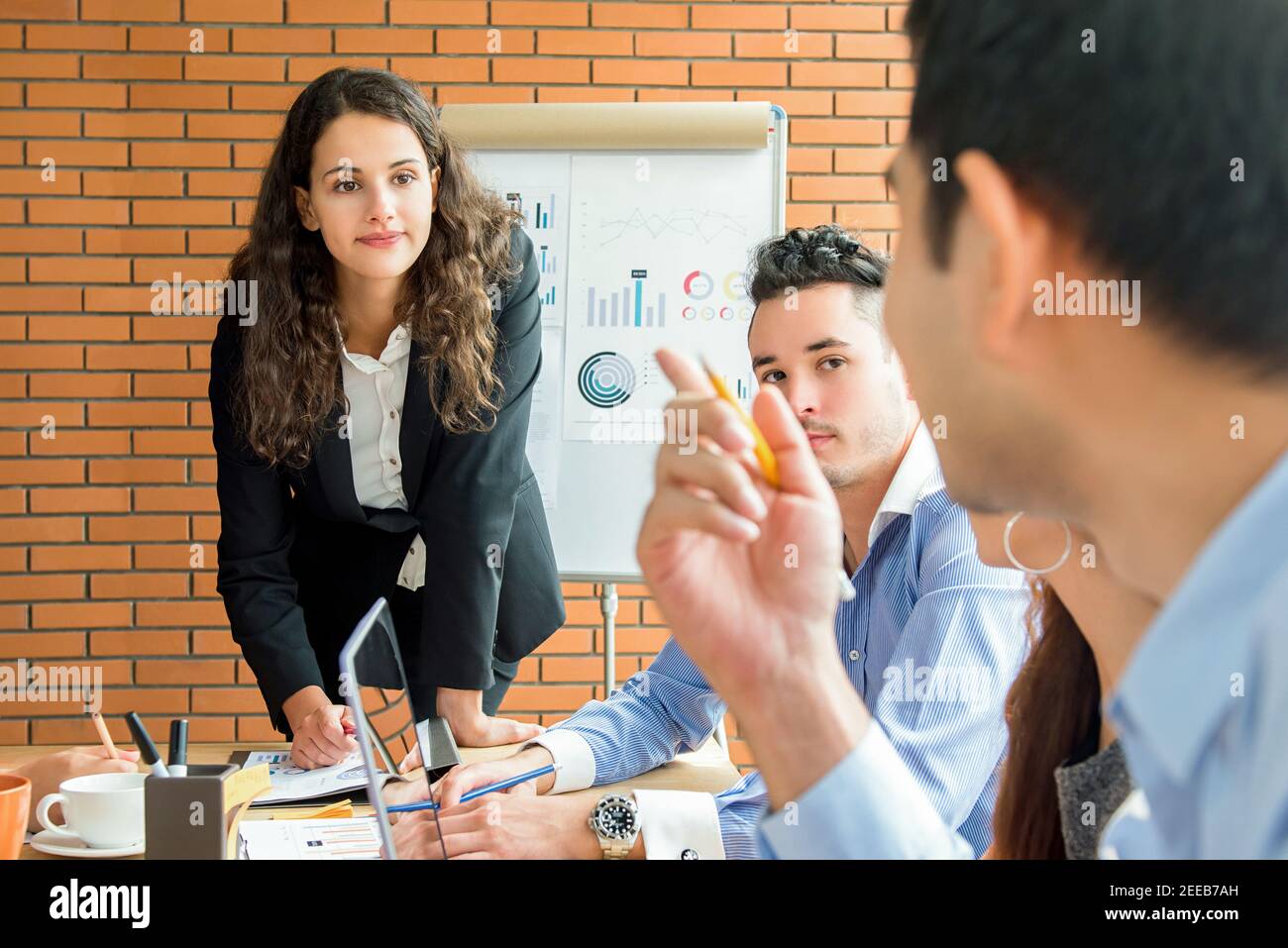 Businesswoman leader listening to her colleague in the meeting Stock Photo