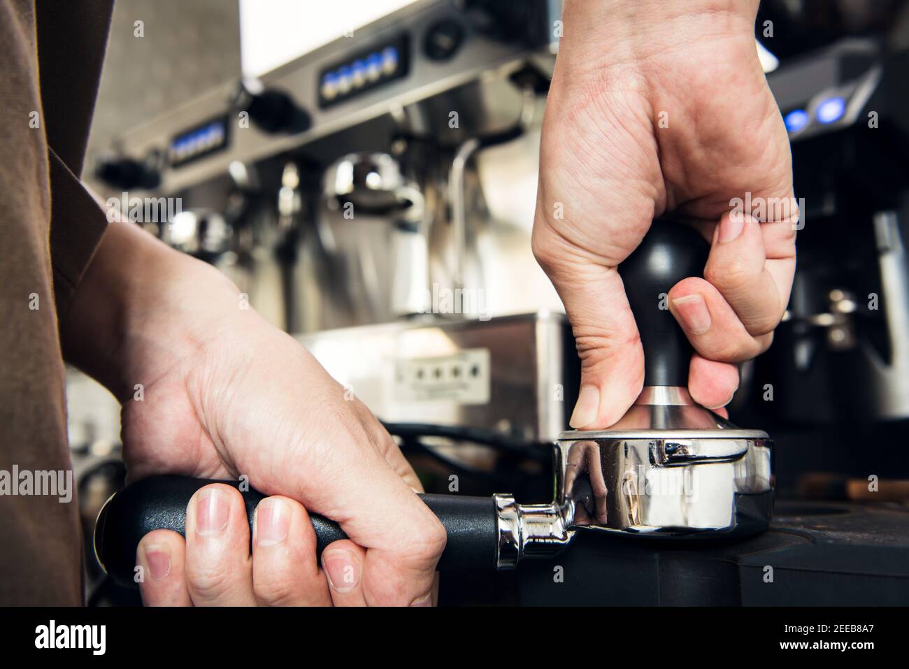 barista holding portafilter with grinded coffee, tamper, cafe, alternative  brew, top view Stock Photo by LightFieldStudios