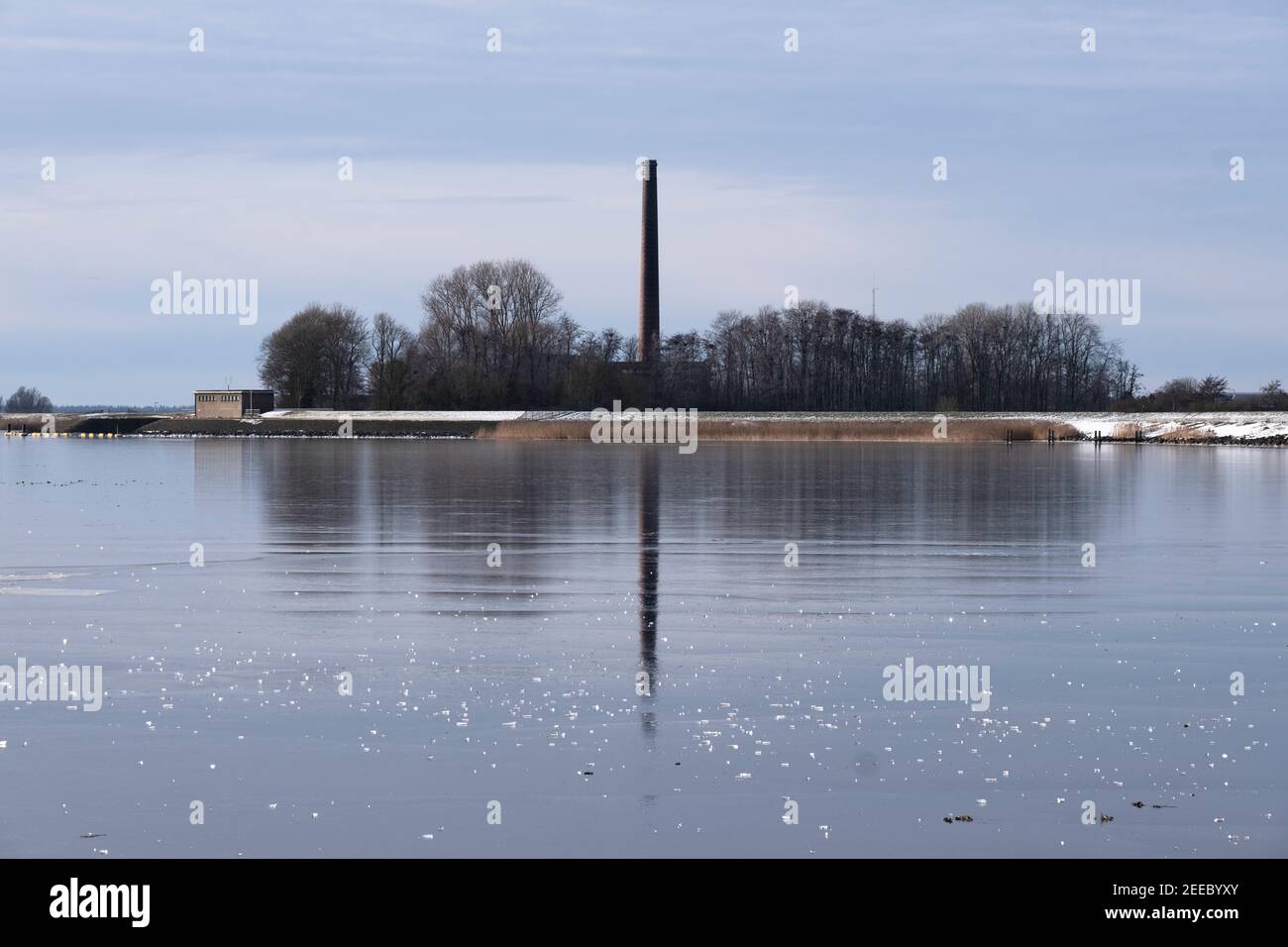 The Woudagemaal pumping station on the frozen IJsselmeer in Lemmer, the Netherlands, the largest steam pumping station in the world. UNESCO Stock Photo
