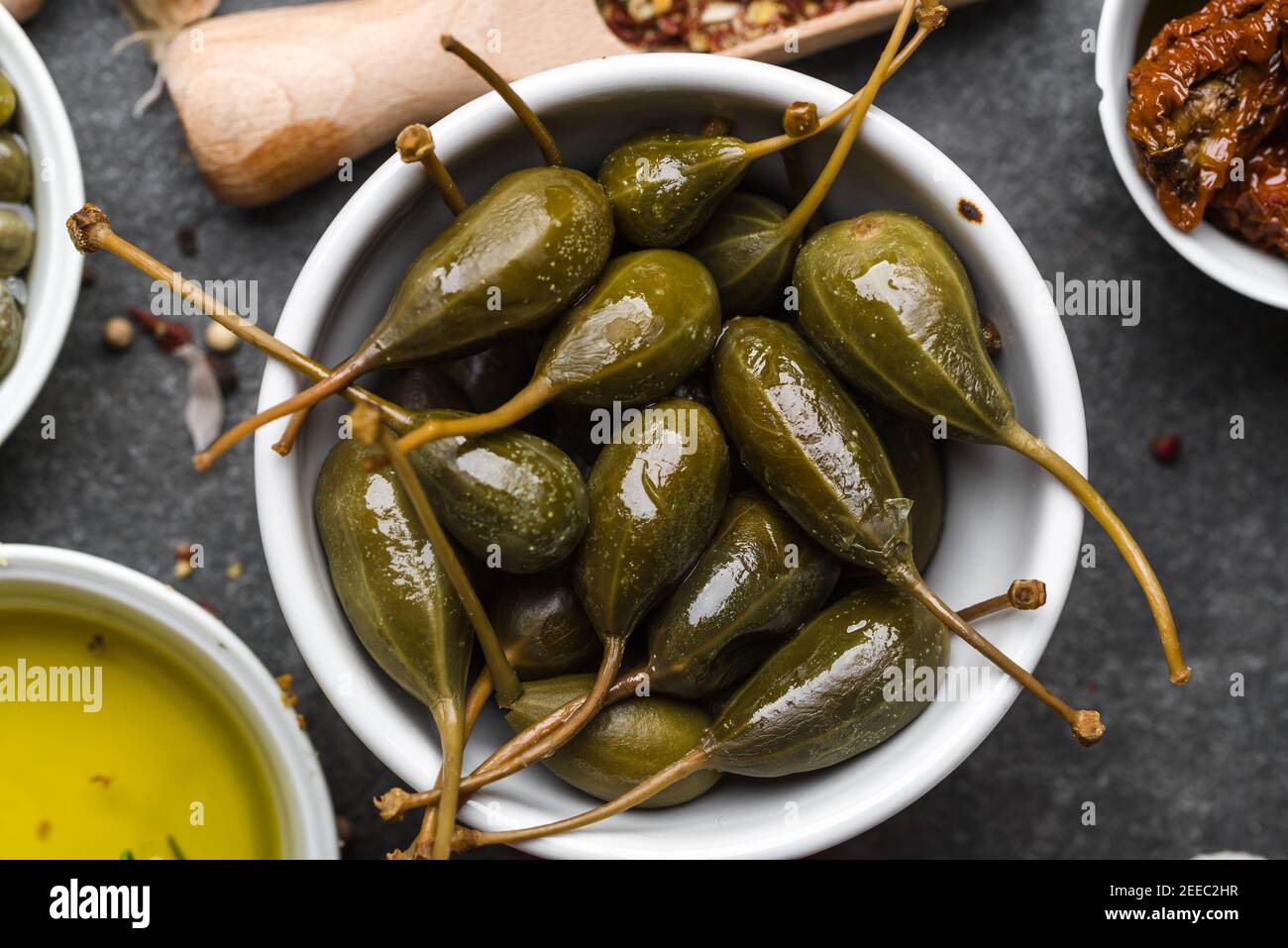 Capers. Marinated cooking ingredients. Mediterranean food background