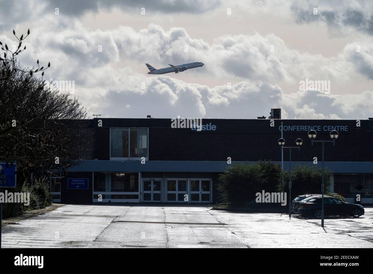 London, Britain. 15th Feb, 2021. An airplane flies over a hotel near Heathrow Airport in London, Britain, on Feb. 15, 2021. From Monday, all British and Irish citizens and British residents who arrive in England after being in the 'red list' of more than 30 high-risk countries now have to self-isolate in hotels. The 'red list' countries include South Africa, Portugal and South American nations. Credit: Ray Tang/Xinhua/Alamy Live News Stock Photo
