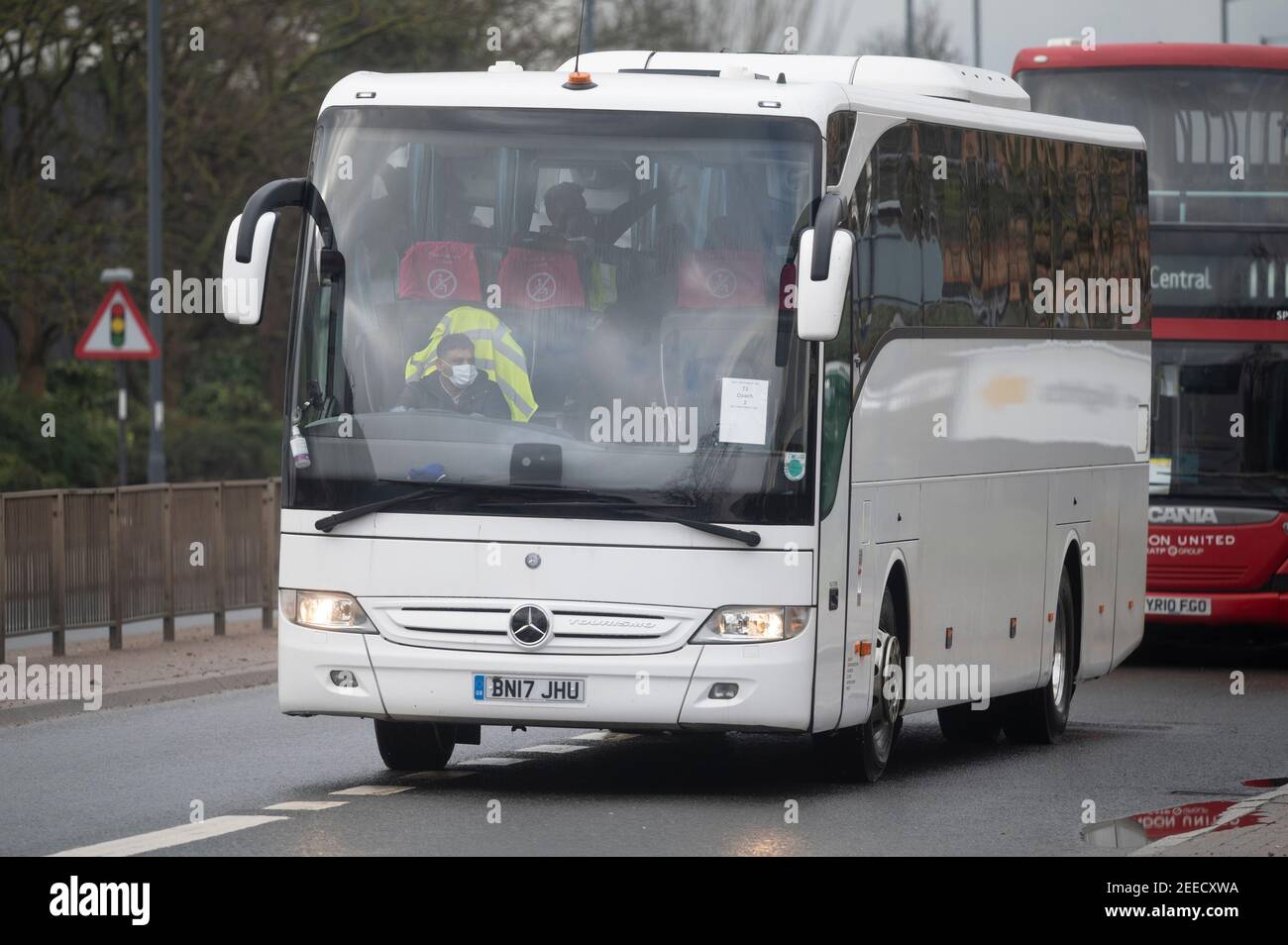 London, Britain. 15th Feb, 2021. Passengers from Heathrow Airport take a bus to Radisson Blu Edwardian Hotel, a quarantine hotel in London, Britain, on Feb. 15, 2021. From Monday, all British and Irish citizens and British residents who arrive in England after being in the 'red list' of more than 30 high-risk countries now have to self-isolate in hotels. The 'red list' countries include South Africa, Portugal and South American nations. Credit: Ray Tang/Xinhua/Alamy Live News Stock Photo