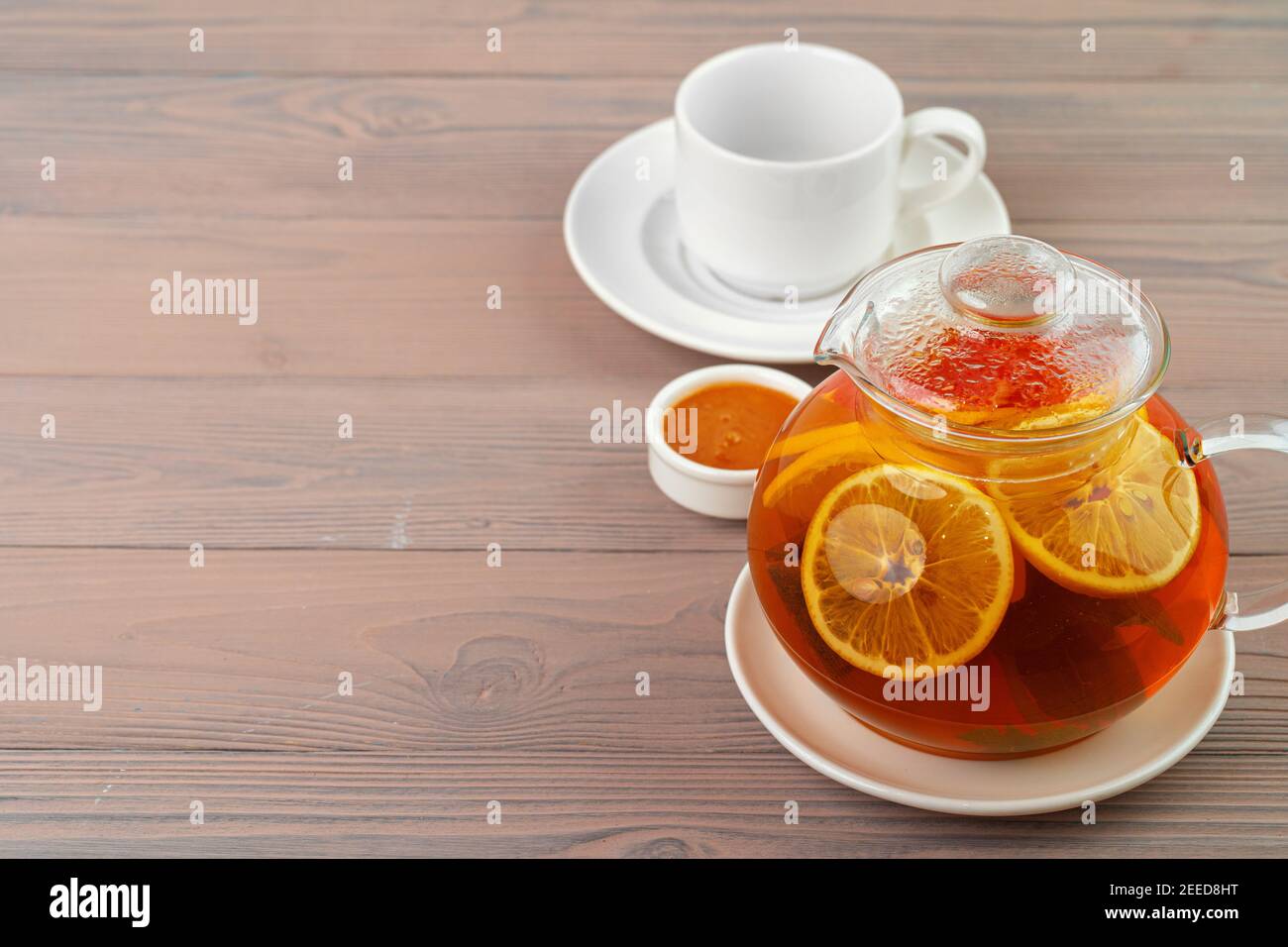 Glass teapot with black tea and pieces of citrus Stock Photo Alamy