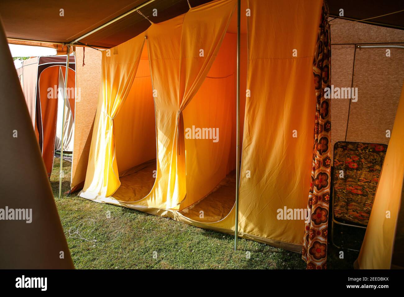 Interior of retro orange 70s Raclet frame canvas tent, Kent Stock Photo