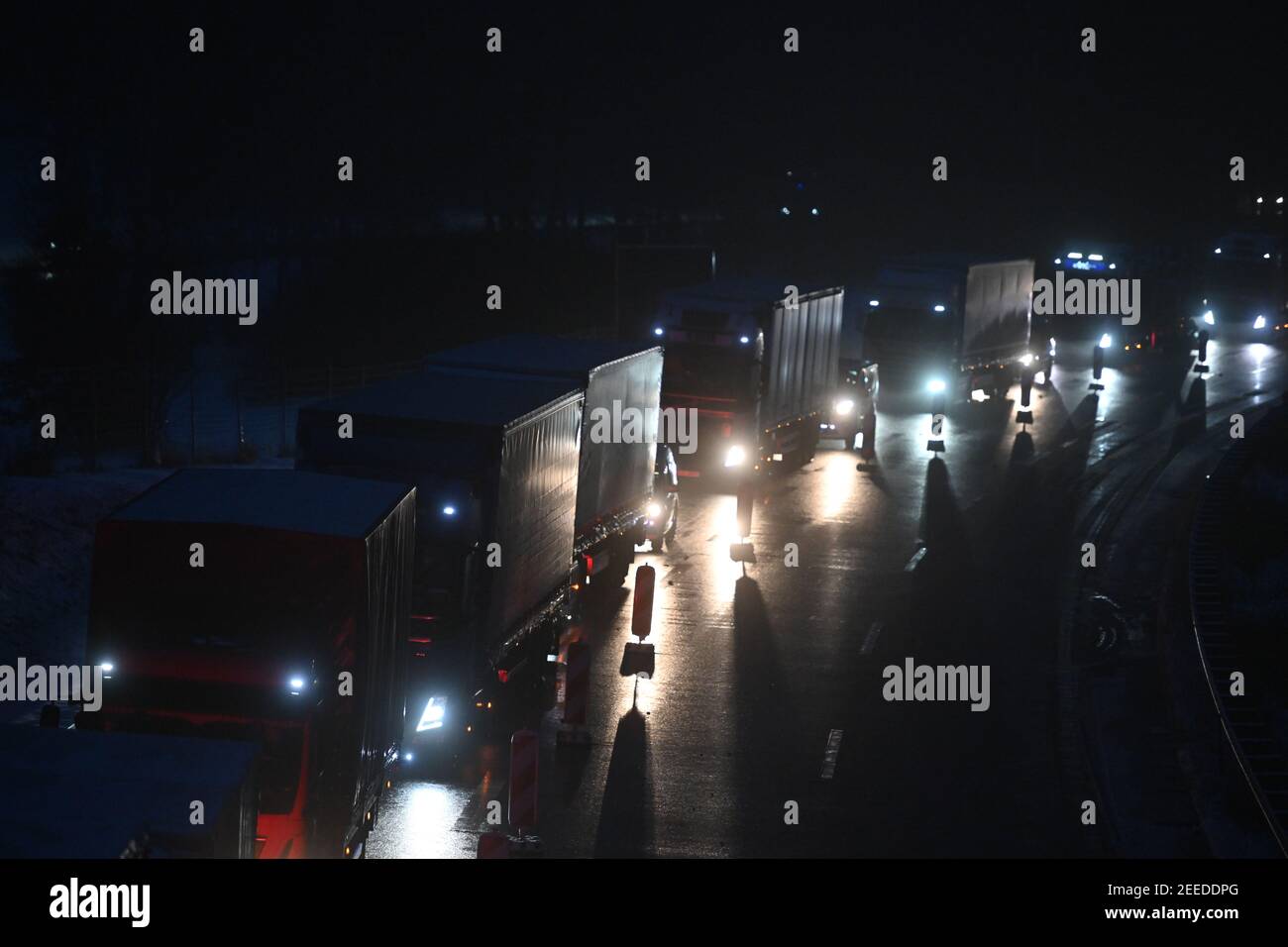 Waidhaus, Germany. 16th Feb, 2021. Trucks standing in a traffic jam near the German-Czech border. The tightened German entry rules at the border with the Czech Republic to protect against dangerous variants of the coronavirus came into force in the night of 14.02.2021. Credit: Armin Weigel/dpa/Alamy Live News Stock Photo
