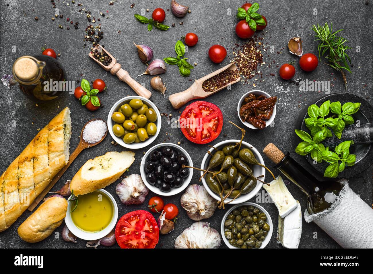 Mediterranean food background. Cooking ingredients on dark stone Stock ...
