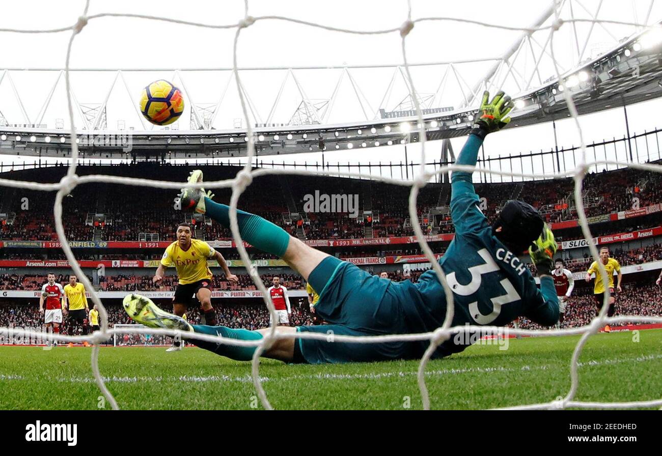 Soccer Football - Premier League - Arsenal vs Watford - Emirates Stadium, London, Britain - March 11, 2018   Arsenal's Petr Cech saves a penalty from Watford's Troy Deeney    REUTERS/Eddie Keogh    EDITORIAL USE ONLY. No use with unauthorized audio, video, data, fixture lists, club/league logos or "live" services. Online in-match use limited to 75 images, no video emulation. No use in betting, games or single club/league/player publications.  Please contact your account representative for further details. Stock Photo