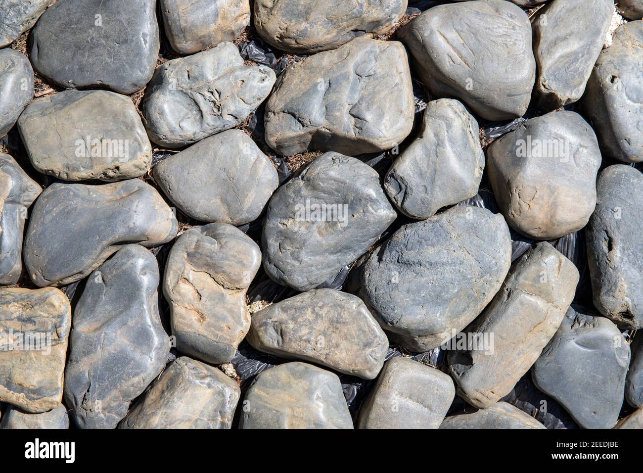 Grungy stone photo texture. Round rocks top view background. Seaside stone paving. Marine coast road. Natural wallpaper with stone mosaic. Black seash Stock Photo - Alamy Grungy stone photo texture. Round rocks top view background. Seaside stone paving. Marine coast road. Natural wallpaper with stone mosaic. Black seash Stock Photo - Alamy