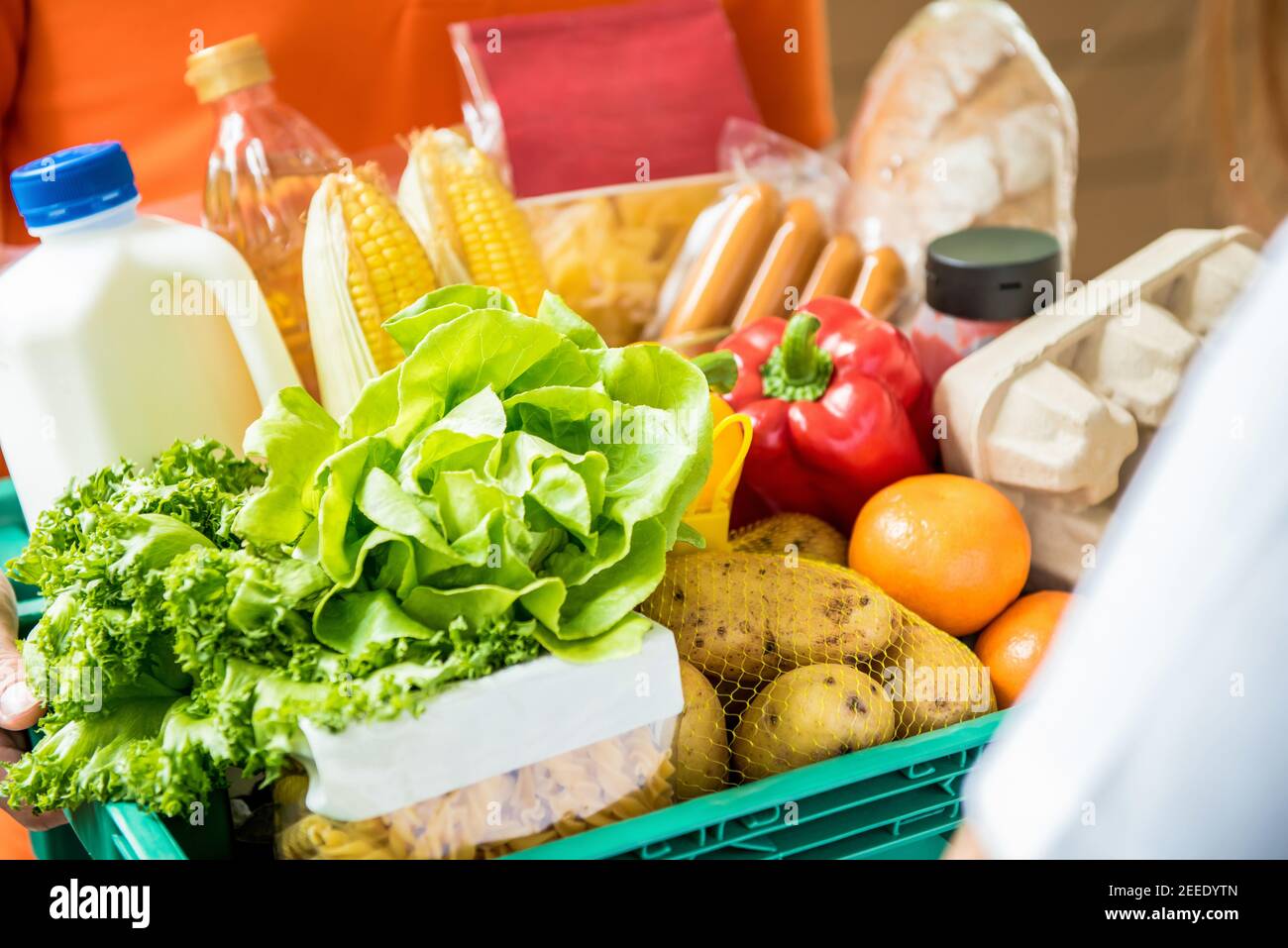 Delivery man delivering food to customer at home - online grocery shopping service concept Stock Photo