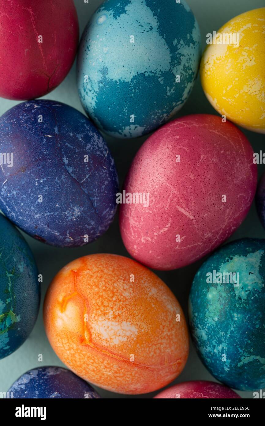 Multicolored Easter eggs on a blue background Stock Photo