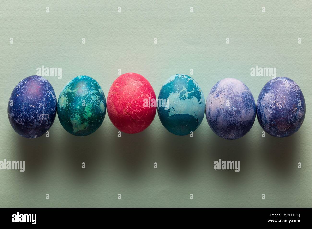 Multicolored Easter eggs on a blue background Stock Photo