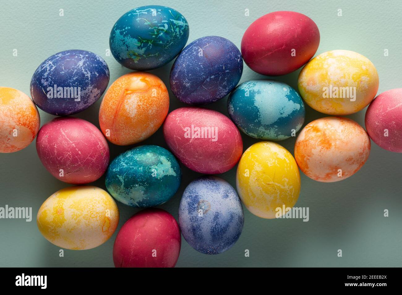 Multicolored Easter eggs on a blue background Stock Photo