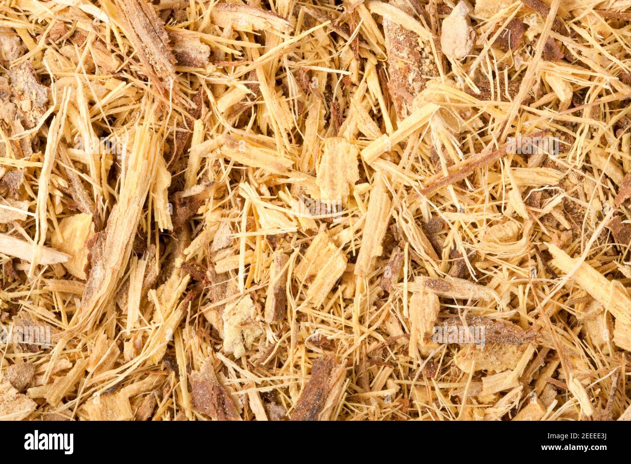 Dried licorice root is grated as a background close-up Stock Photo