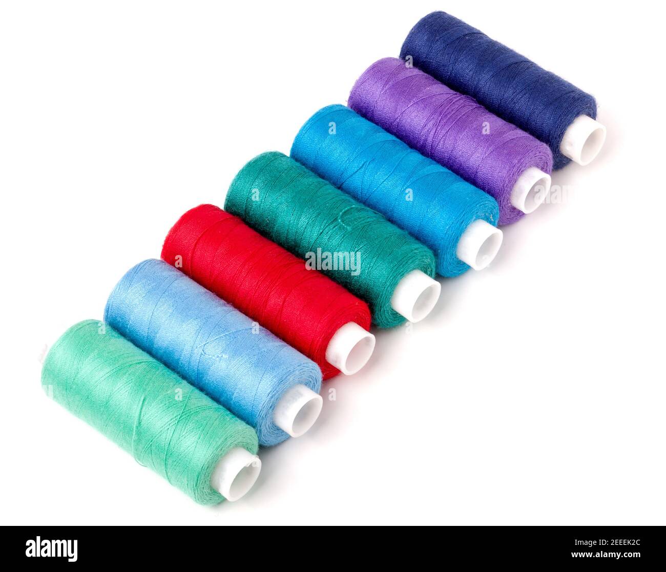 colored thread for sewing isolated on white background Stock Photo - Alamy