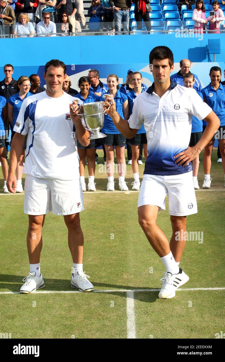 Tennis - AEGON Championships - Queens Club, London - 13/6/10 Israel's  Jonathan Erlich and Serbia's Novak Djokovic (R) celebrate with the trophy  after their win in the mens doubles final Mandatory Credit: