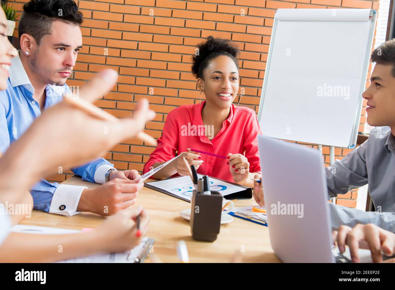 Mixed-race business team brainstorming at the meeting in creative office Stock Photo