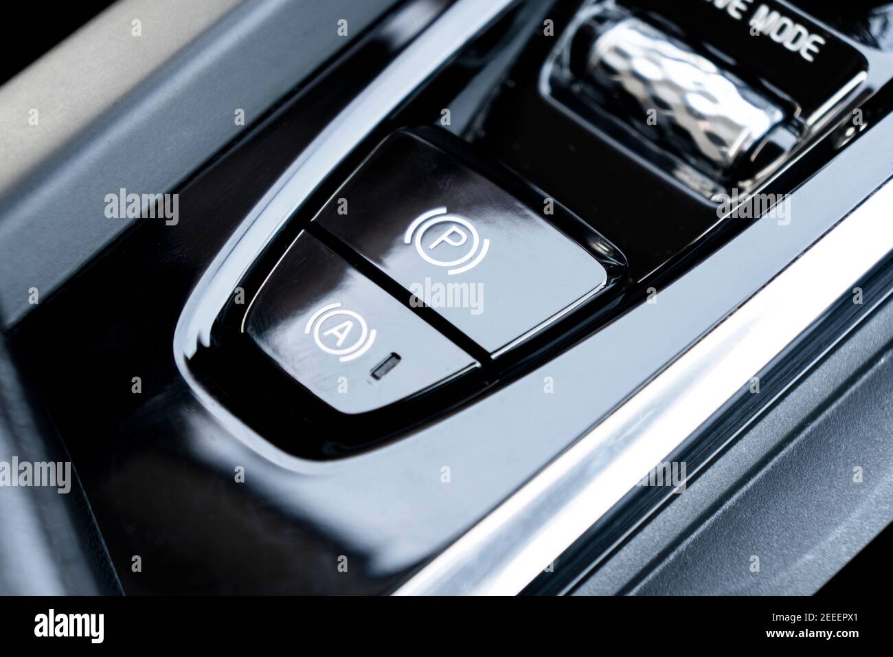 Detail of a parking brake in a nodern car. Electronic parking brake button in a modern car
