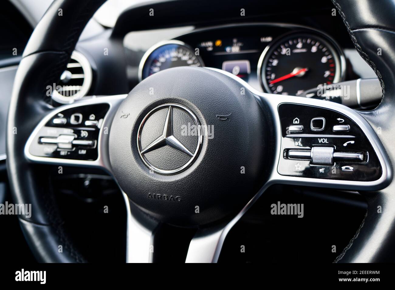 Sankt-Petersburg, Russia, February 10, 2021: Dashboard and steering wheel with media control buttons of a Mercedes Benz E-class . Car interior details Stock Photo