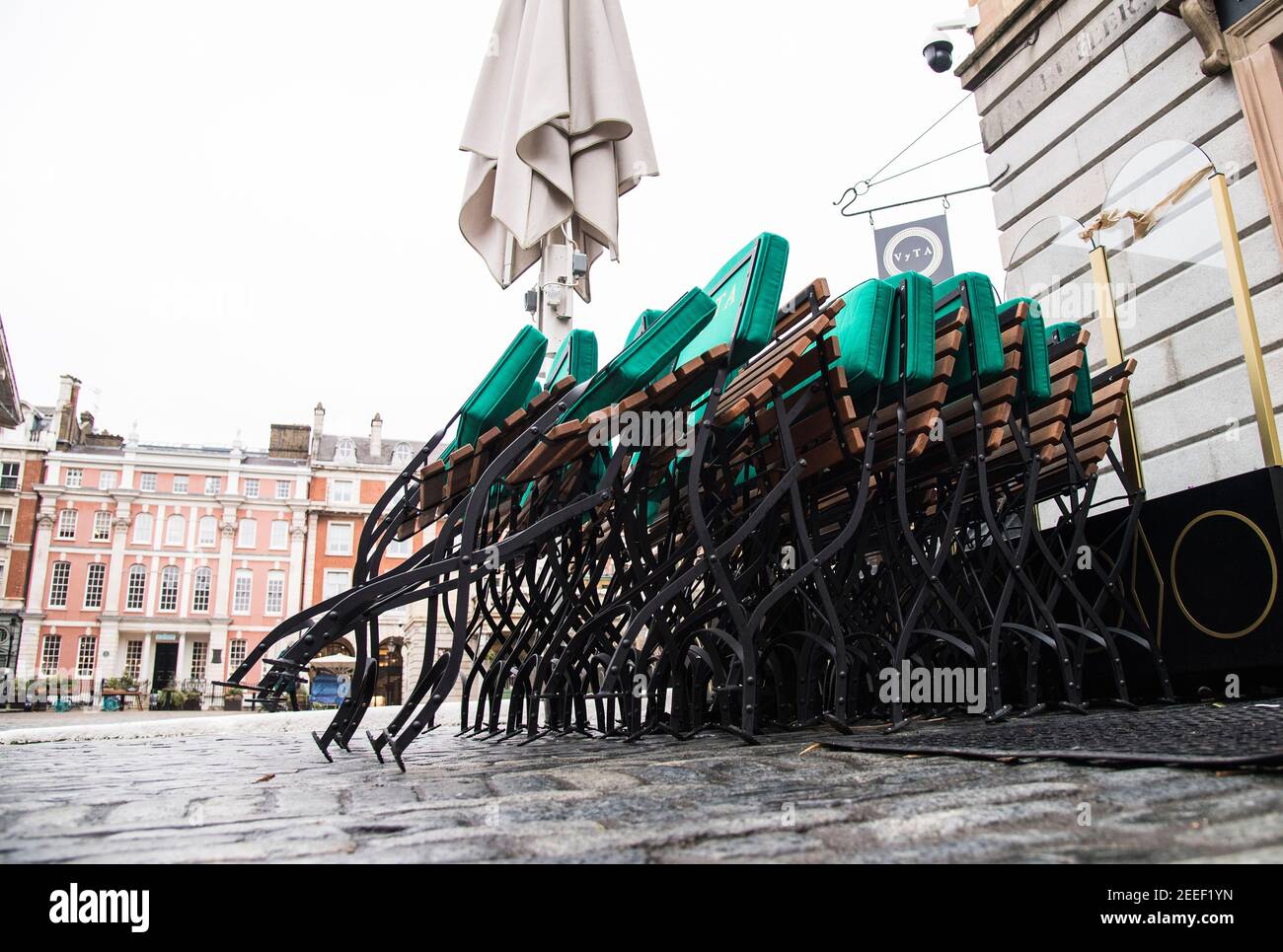 Stacked chairs in Covent Garden, London during England's third national lockdown to curb the spread of coronavirus. Picture date: Tuesday February 16, 2021. Stock Photo