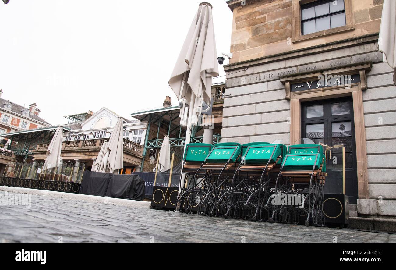 Stacked chairs in Covent Garden, London during England's third national lockdown to curb the spread of coronavirus. Picture date: Tuesday February 16, 2021. Stock Photo