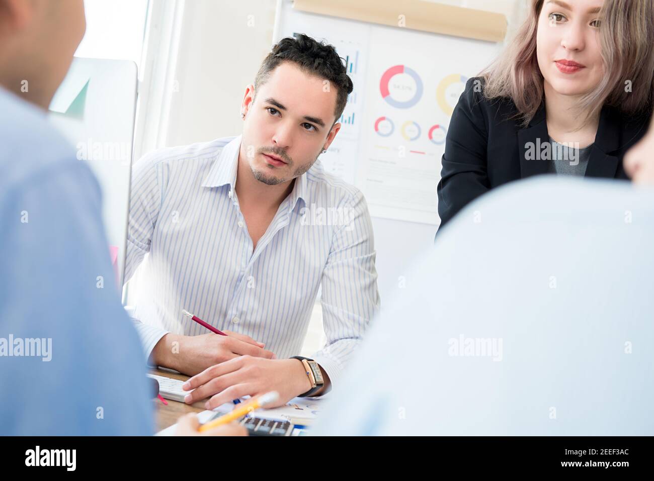 Business people paying attention to their colleague in the meeting Stock Photo