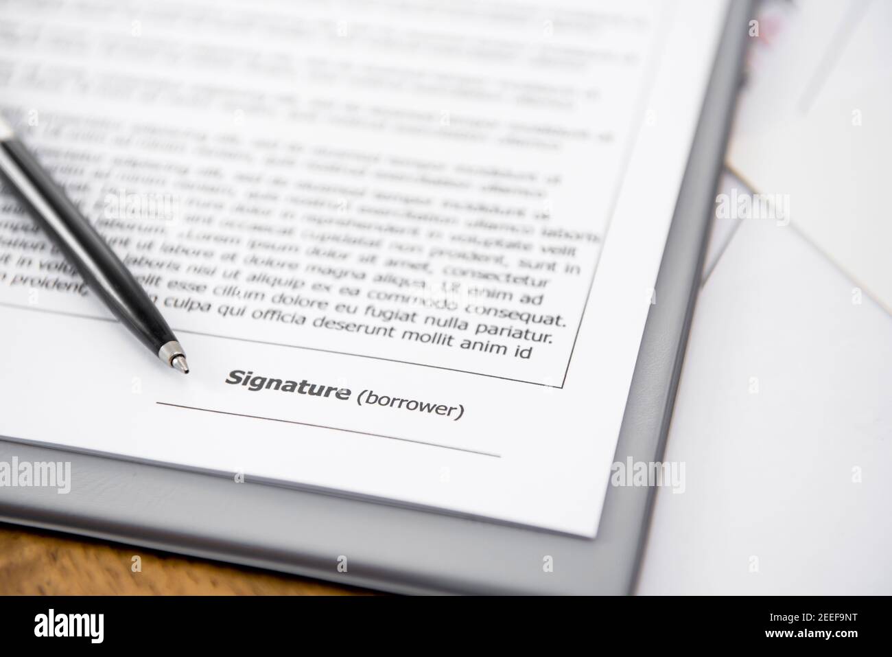 Blank signature line on loan agreement Stock Photo