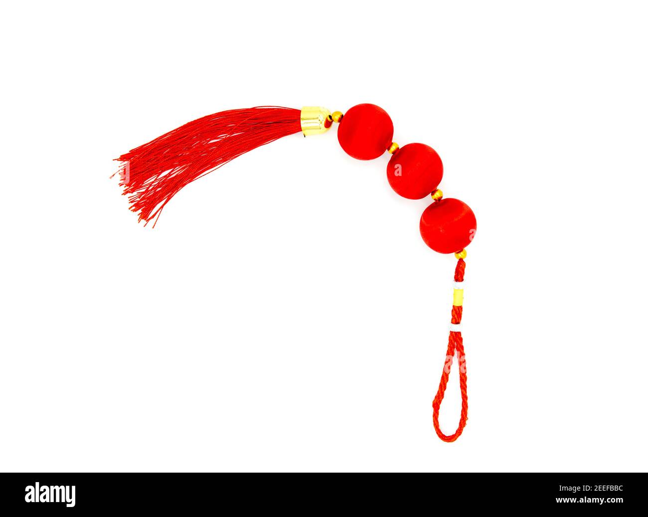 Chinese red knot with tassel, top view photo. Asian holiday symbol. Red silk knot isolated. Chinese New Year decoration. Oriental decor for prosperity Stock Photo