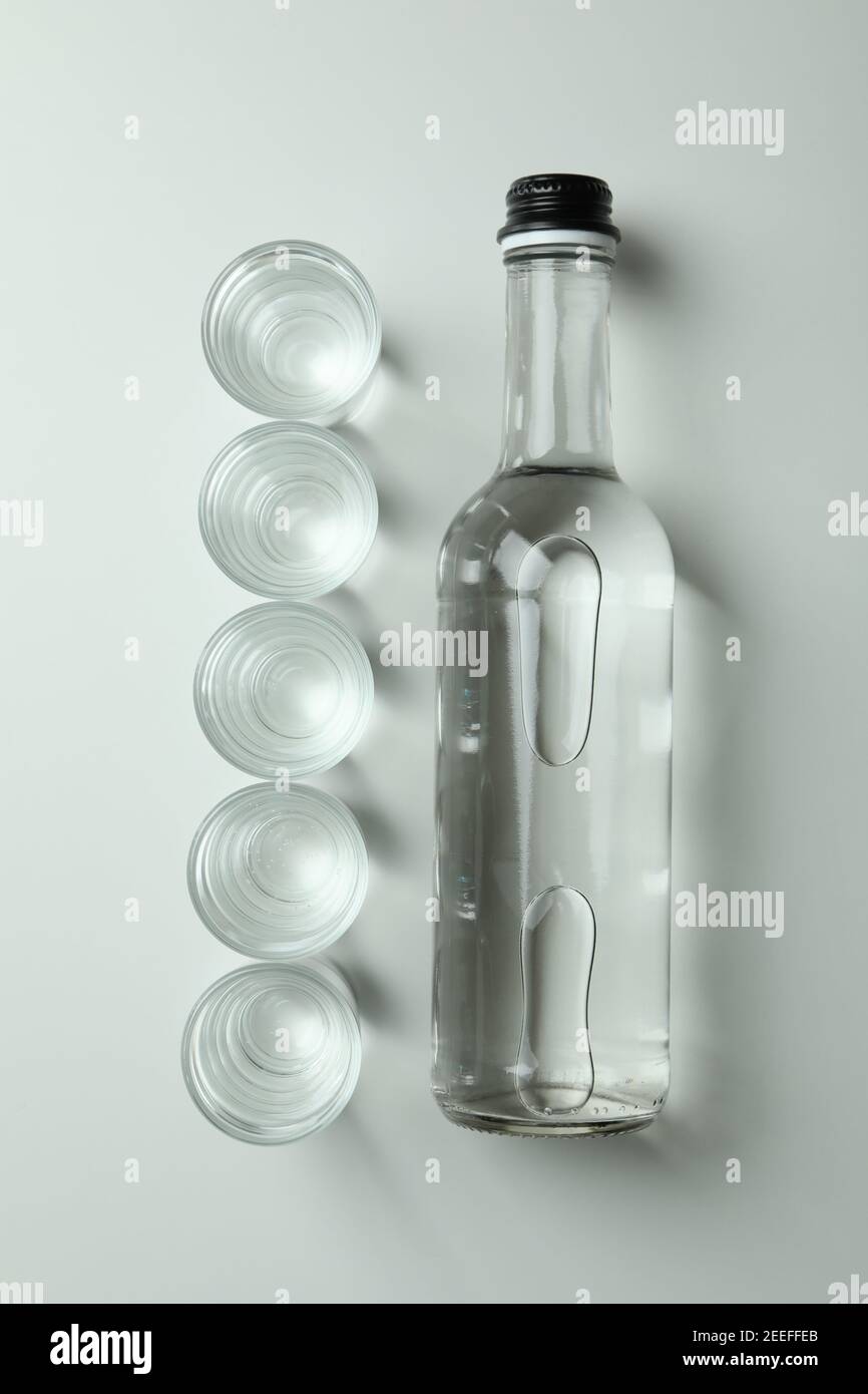 Bottle and shots of vodka on white background Stock Photo Alamy