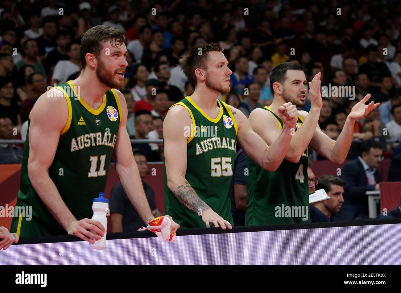 Basketball - FIBA World Cup - 3rd Place Game - France v Australia - Wukesong Sport Arena, Beijing, China - September 15, 2019  Australia's Nic Kay, Mitch Creek and Chris Goulding on the bench during the match REUTERS/Jason Lee Stock Photo