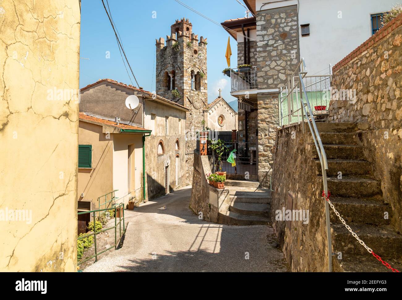 Narrow street of the charming Tuscany village Mommio Castello, at the top of the hill of Versilia, province of Lucca, Italy Stock Photo