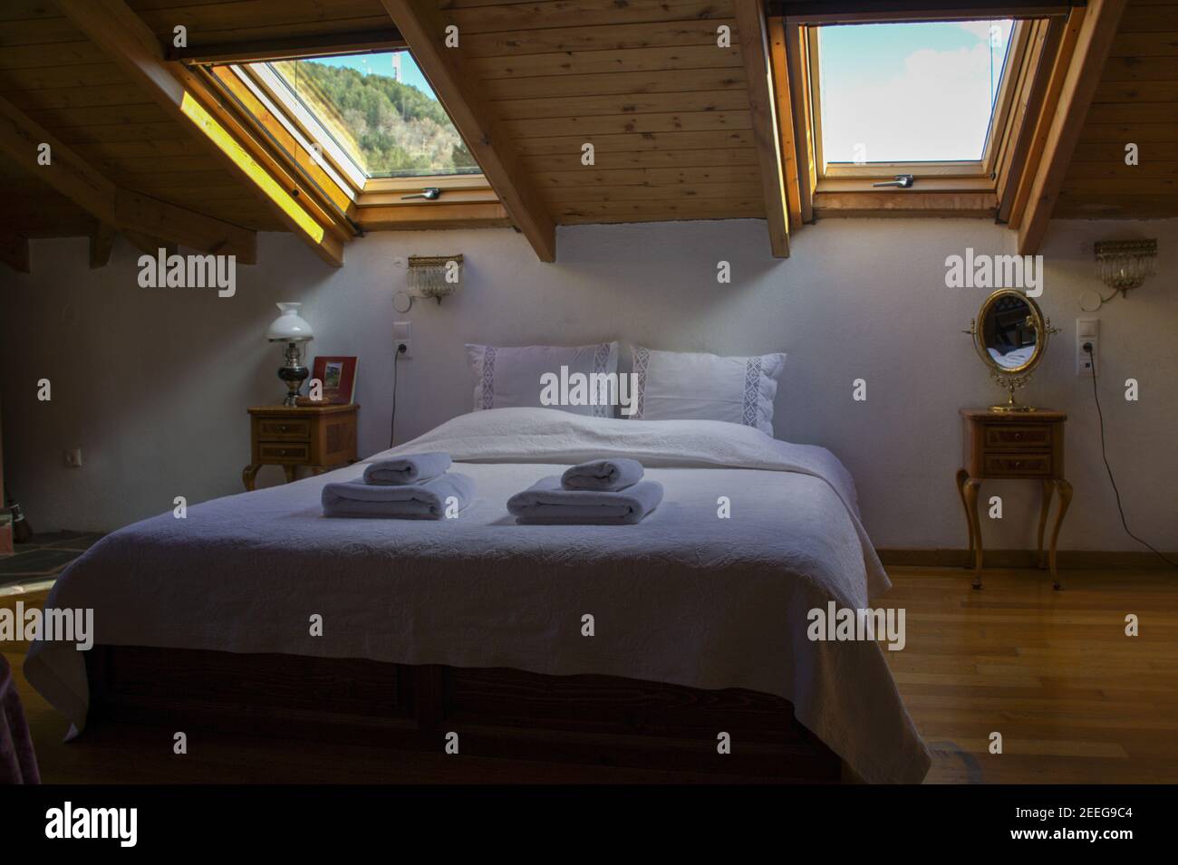 Attic cozy empty hotel bedroom Stock Photo - Alamy