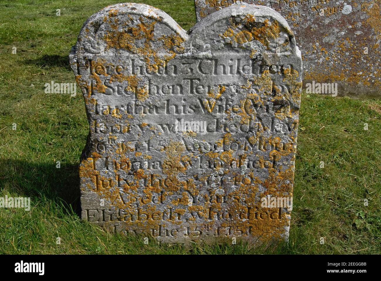 A sad but typical tale of 1700s English rural infant mortality is told by this headstone in the graveyard of St Augustine’s parish church at Brookland, Kent, amid the low-lying wetlands of Walland Marsh.  It records the death in infancy or childhood between 1740 and 1751 of three children born to Martha and Stephen Terry - at a time when infant death rates in marshland parishes were two to three times higher than in downland villages.  Romney and Walland marshes were afflicted by infectious and chronic diseases such as bubonic plague and smallpox - and by malaria, which was once endemic. Stock Photo