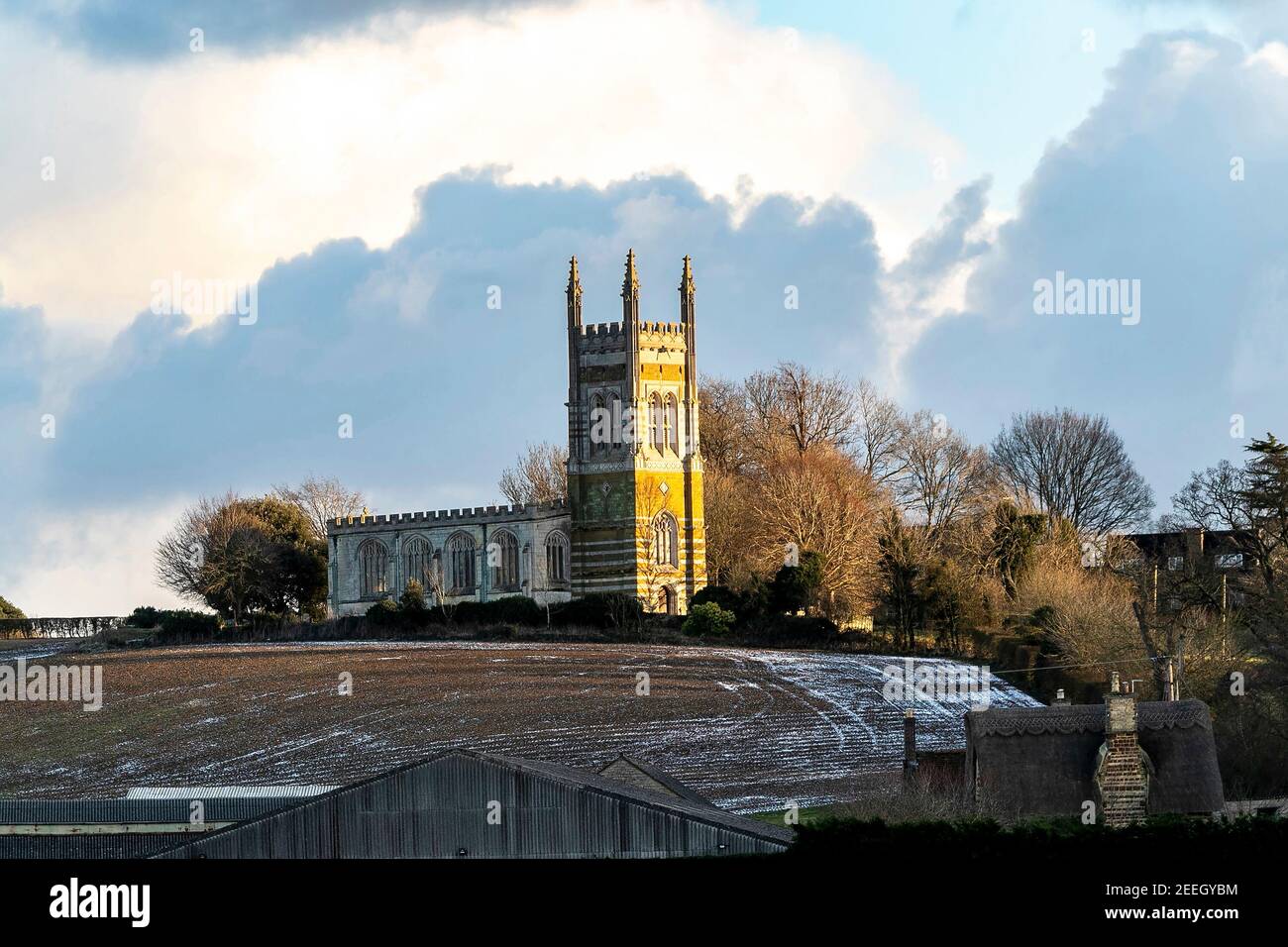 The church of St Mary the Virgin with the late afternoon sun giving the stonework a golden glow