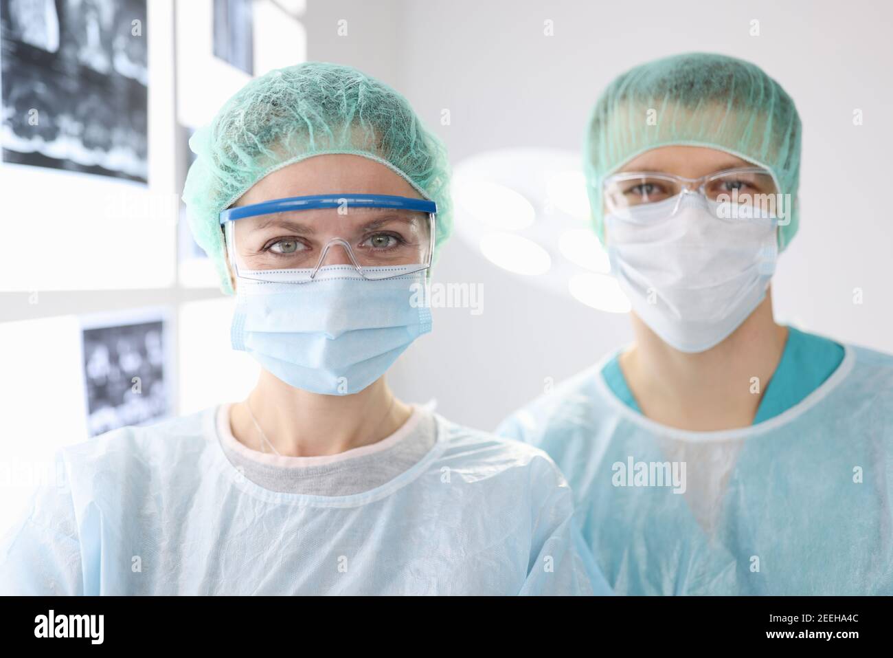 Portraits of doctors surgeons in protective clothing in clinic Stock Photo Alamy