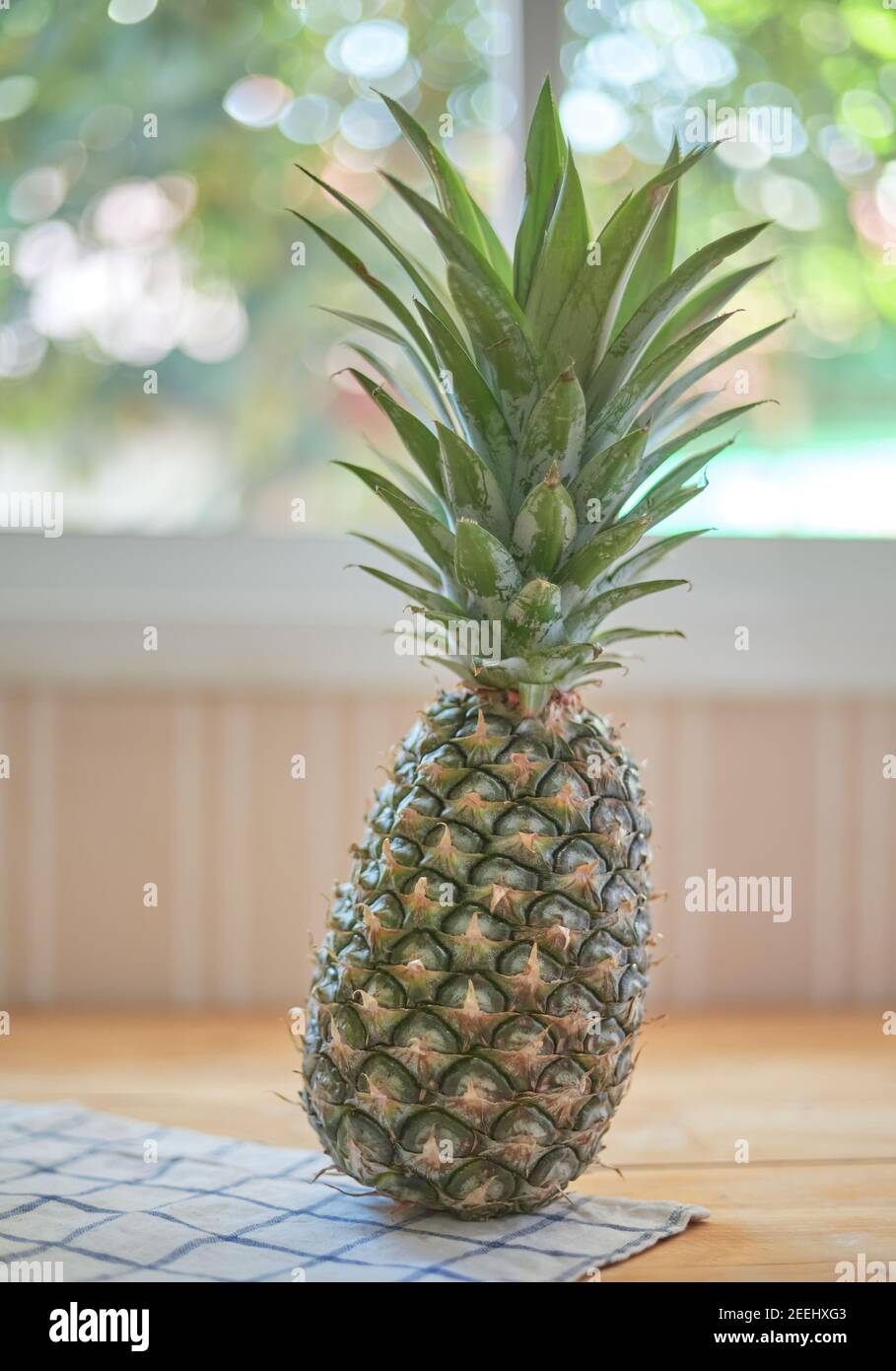 Pineapple on the wooden table Stock Photo