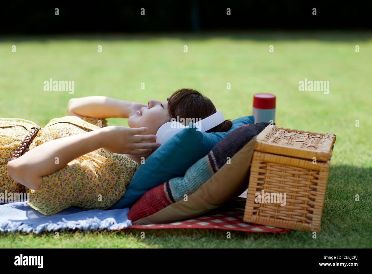 Japanese woman relaxing in the garden Stock Photo - Alamy
