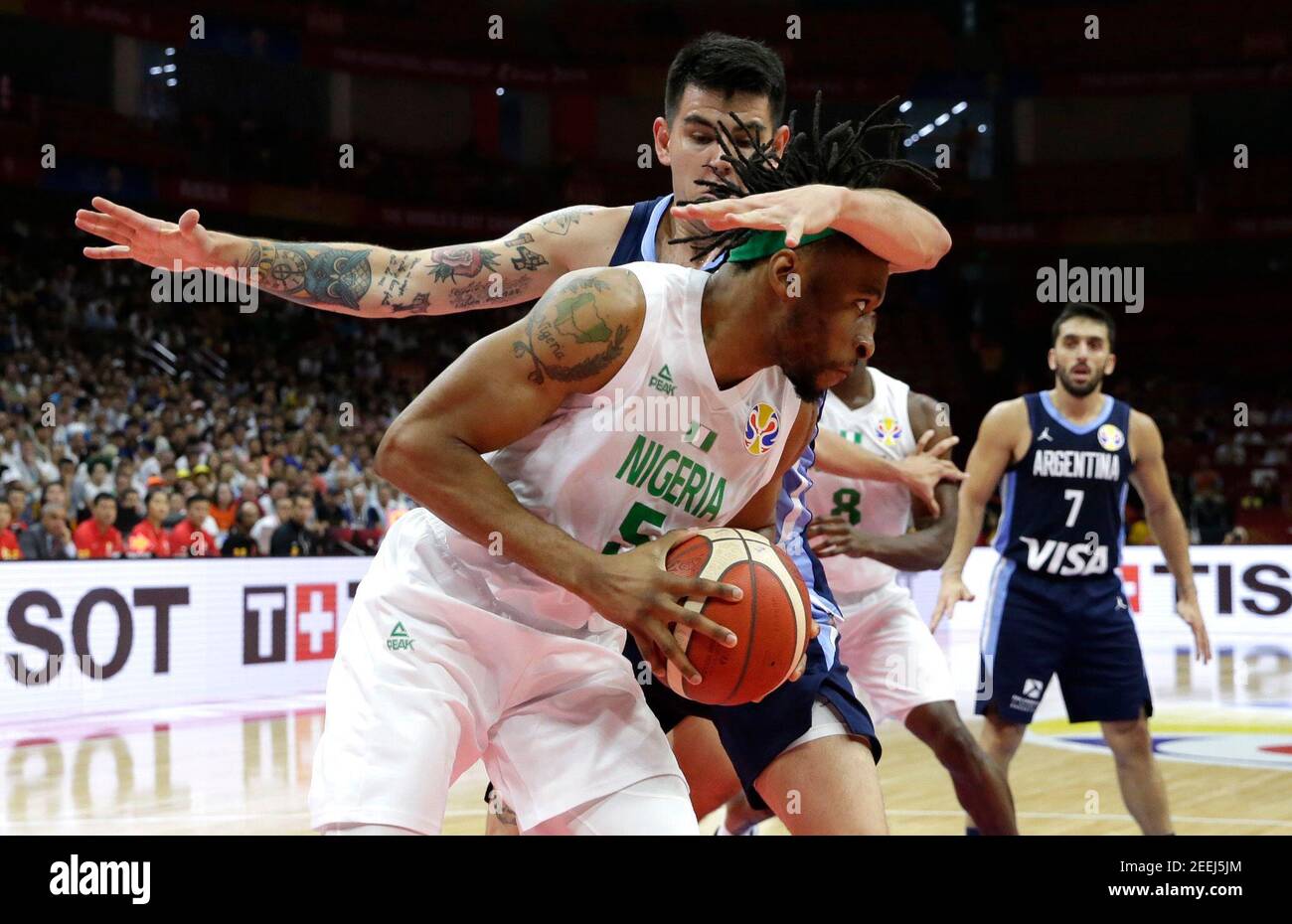 Basketball - FIBA World Cup - First Round - Group B - Nigeria v Argentina - Wuhan Sports Center, Wuhan, China - September 2, 2019 Nigeria's Stan Okoye in action with Argentina's Gabriel Deck REUTERS/Jason Lee Stock Photo