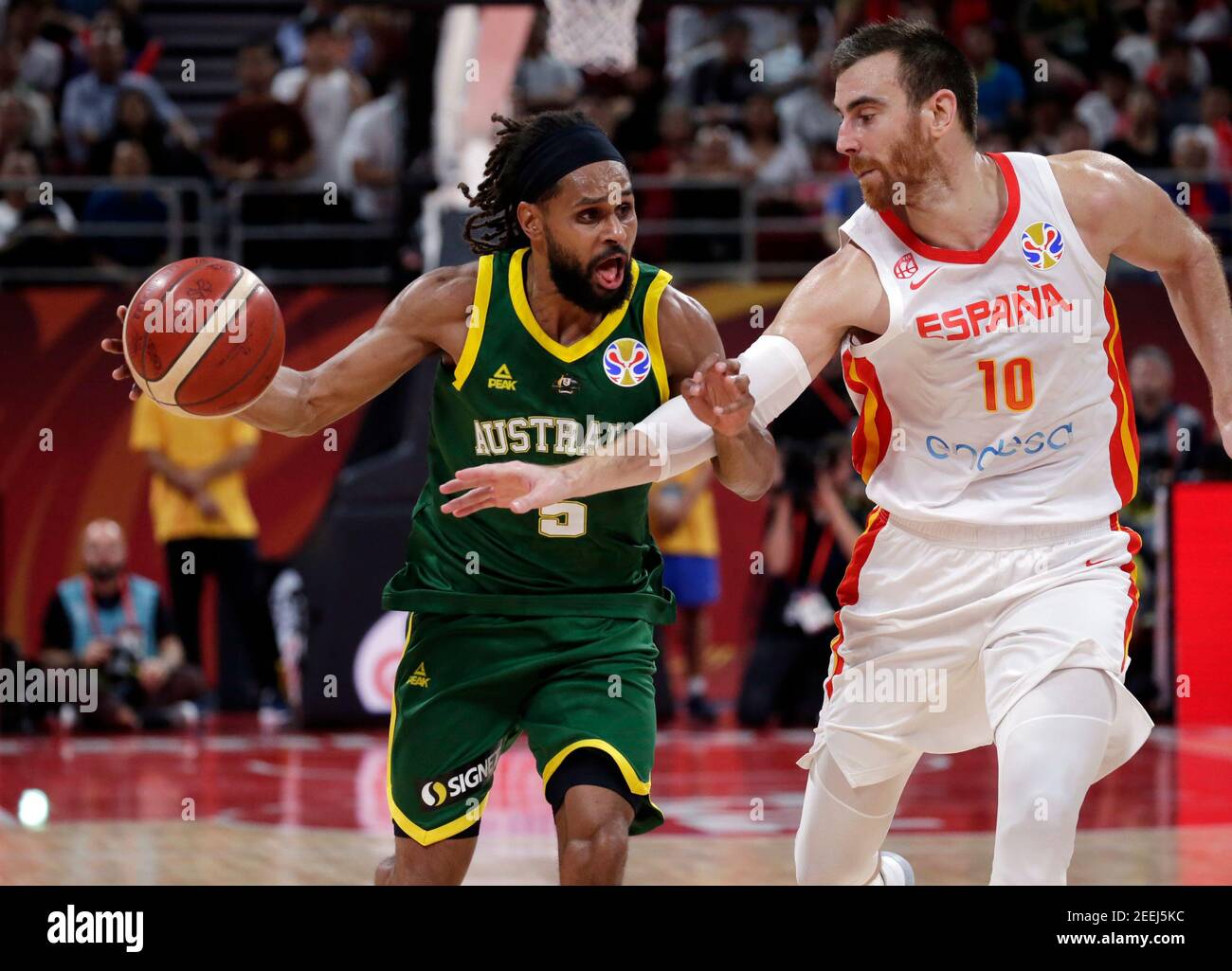 Basketball - FIBA World Cup - Semi Finals - Spain v Australia - Wukesong Sport Arena, Beijing, China - September 13, 2019  Australia's Patty Mills in action with Spain's Victor Claver REUTERS/Jason Lee Stock Photo