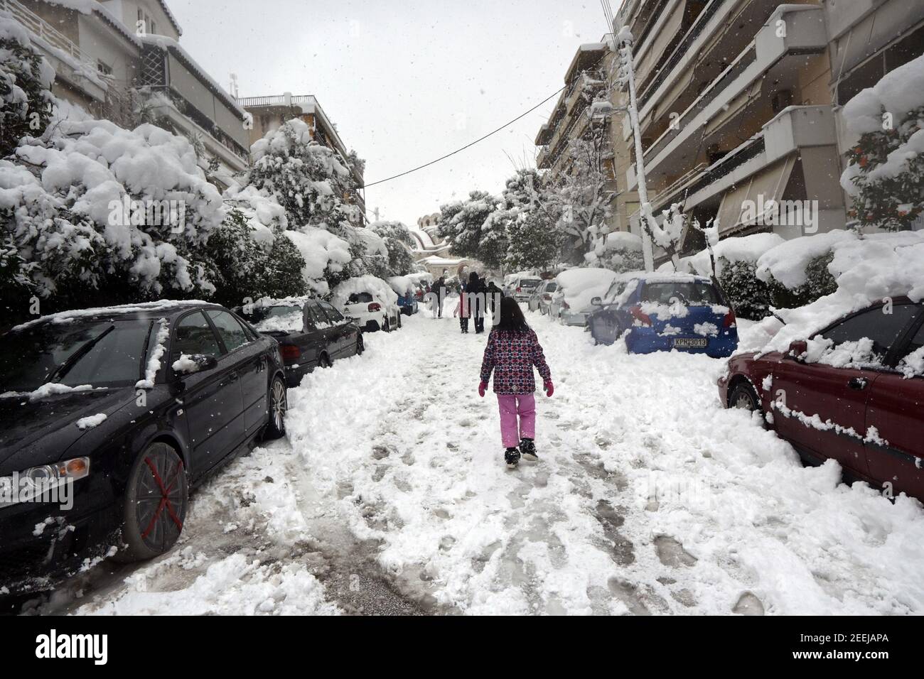 Snow In Athens Athens, Greece. 16th Feb., 2021. People walk in a street covered in ...