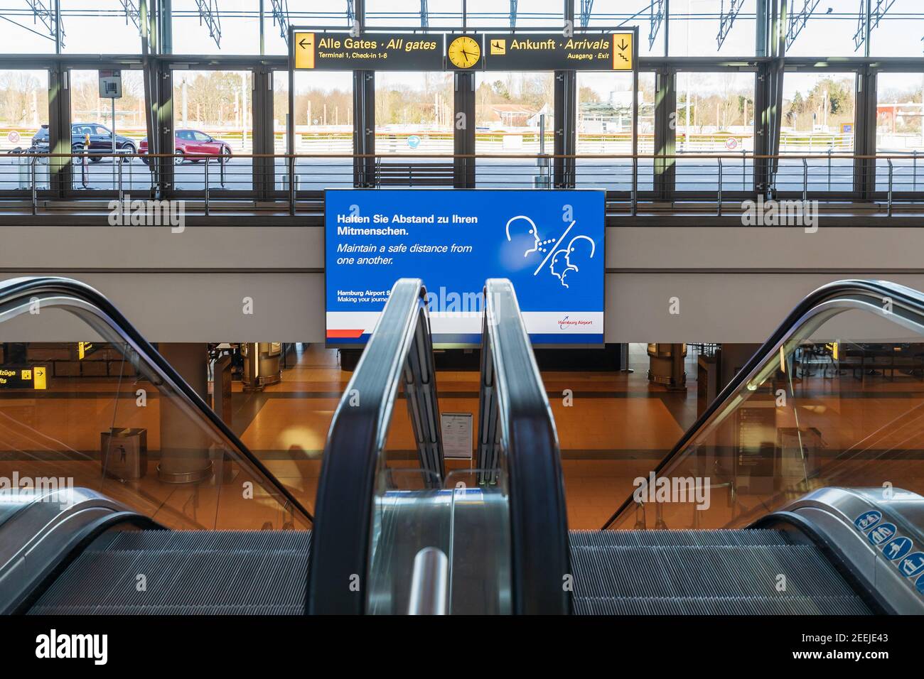 Message for the passengers entering the s-bahn station at the Hamburg airport,  to maintain a distance, because of the Covid-19 epidemic Stock Photo
